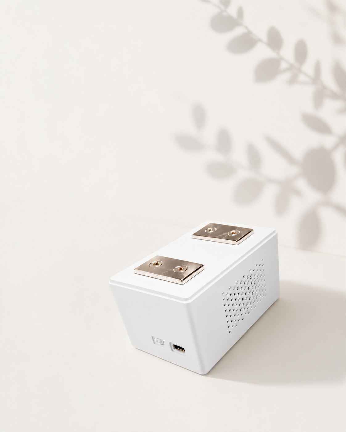 The BedDot sensor with its two mounting magnets