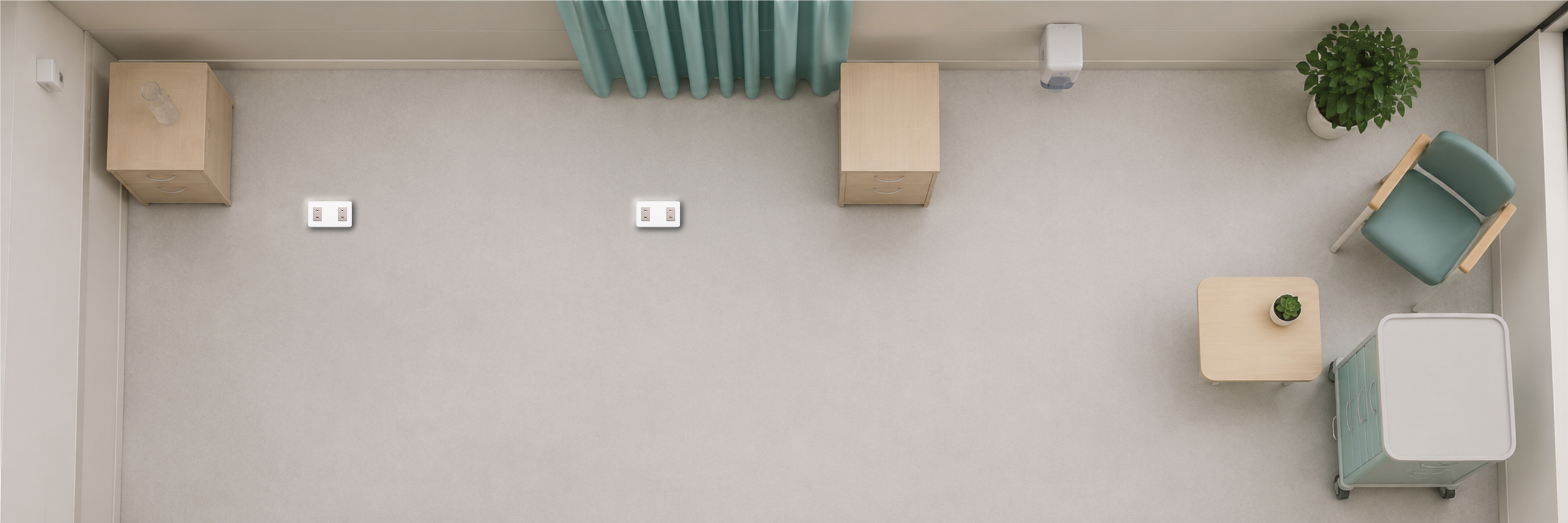 Top-down view of an empty clinical room with BedDot devices on the floor